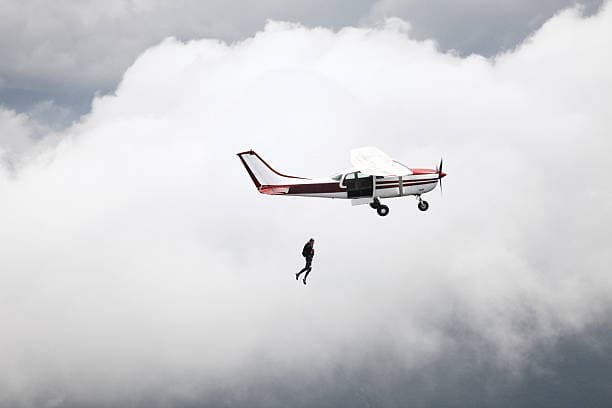 A rigger inspecting skydiving gear